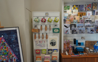 The gift shop at Experience Barnsley, where keyrings, mugs, and cards are all on display.